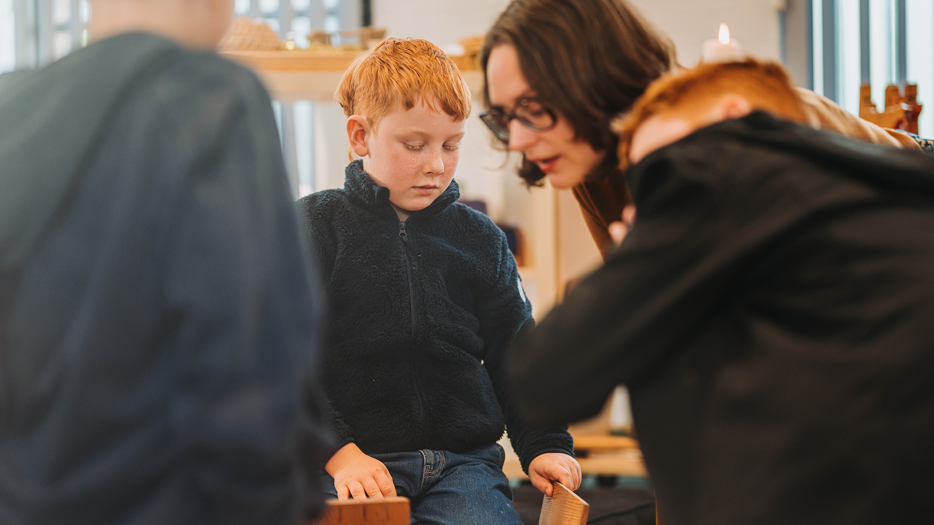 child in kids church learning from leader