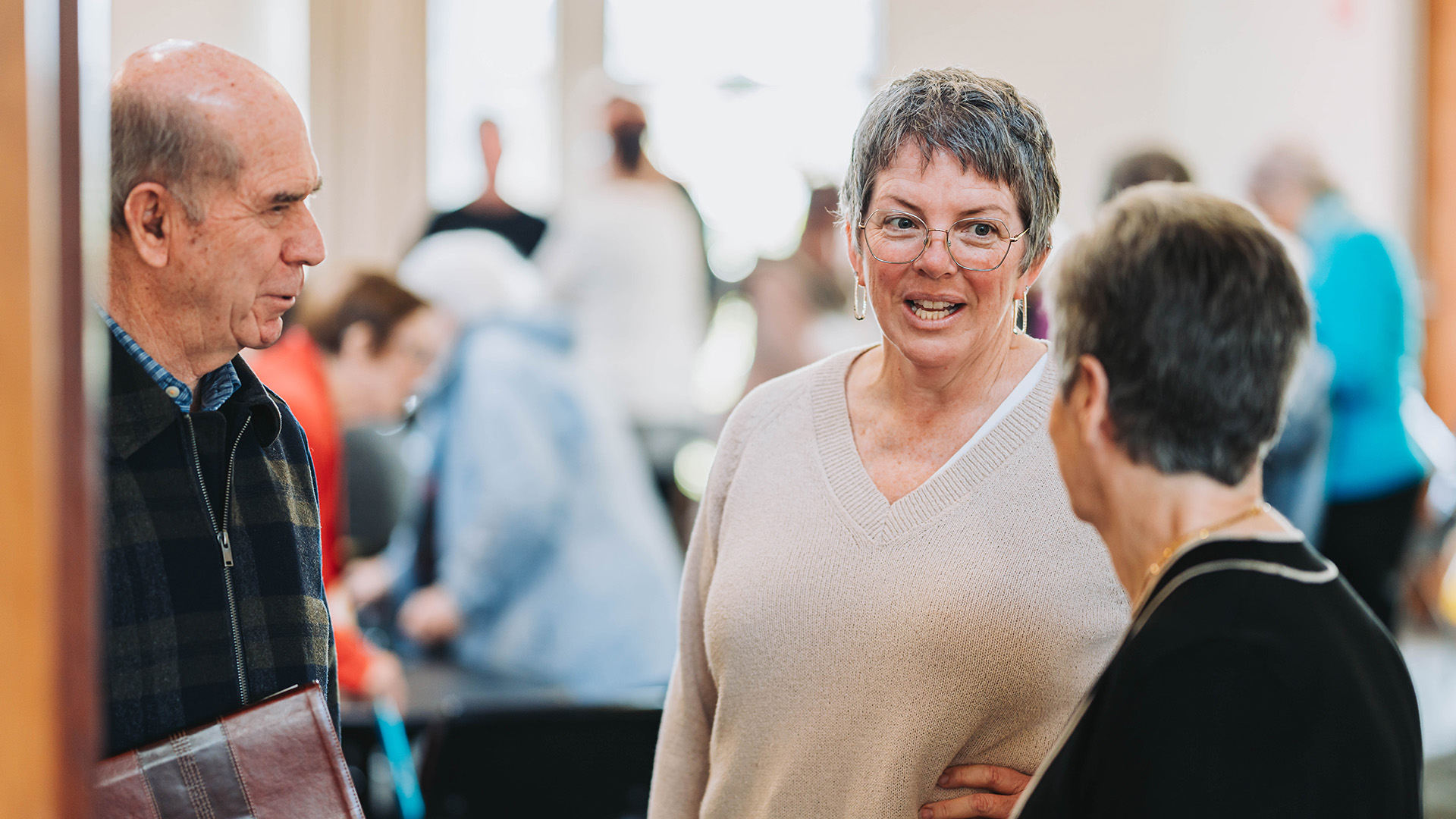 staff member talking with congregation members